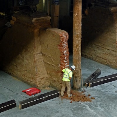 Worker documenting foundation work on a construction site